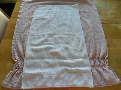 Re-Purpose Worn Bath Towels Into Smaller Hand Towels